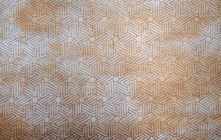 Abstract mosaic of Arabic and Moorish art in the Nasrid Palaces of the Alhambra in the city of...