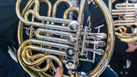 Close-up view of a shiny French horn, brass wind instrumentの写真素材