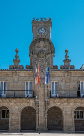 The arcade, facade and clock tower at the town hall of Lugo, Spainの写真素材
