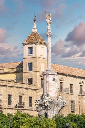 Monument to the Triumph of Saint Raphael and the tower of the Bishopric of Cordoba, Spain. With edited skyの写真素材