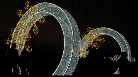 Beautiful tunnel and arches of lights for Christmas next to the cathedral of Valladolid, Spainの写真素材