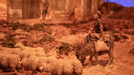Nativity scene for Christmas. Shepherd riding a donkey leading a flock of sheep.の写真素材