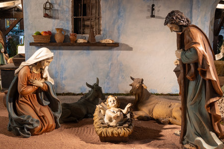 Life-size Nativity scene with baby Jesus, the Virgin Mary and Saint Joseph in a nativity scene in the main square of Valladolid, Spainの写真素材