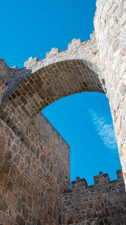 Arch and fortified and crenellated wall of the San Vicente gate in the city of Avila, Spain