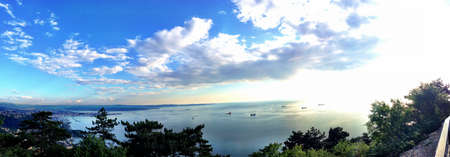 Stunning city view with an amazing sunset and seaの素材