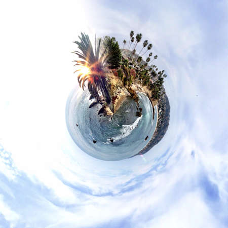 Abstract globe with beach and city skyline at sunset!の素材