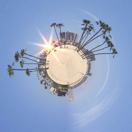 Abstract globe with beach and city skyline at sunset!の素材