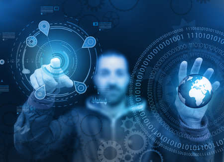 Man touching a glass panel full of informations and graphs. Idea to show business infographics conceptの写真素材