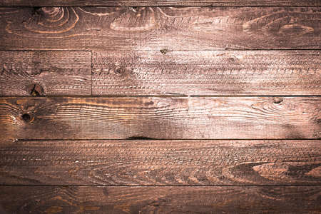 Natural Dark Wooden background. Old dirty wood tables or parquet with knots and holesの写真素材