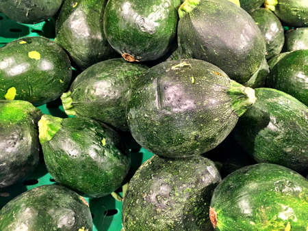 Close up of a big box of Zucchini at the super market in vegetables section.の写真素材