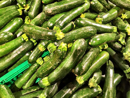 Close up of a big box of Zucchini at the super market in vegetables section.の写真素材