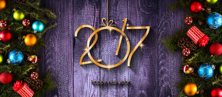 2017 Happy New Year seasonal background with real wood green pine, colorful Christmas baubles, gift...