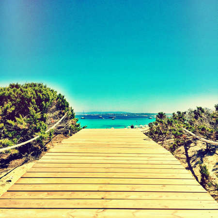 Beatiful Sunny Beach day in Formentera Spain in the middle of the holiday summer season.の写真素材