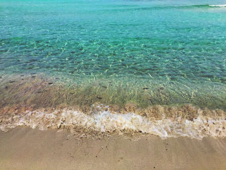 Beatiful Sunny Beach day in Formentera Spain in the middle of the holiday summer season.の写真素材