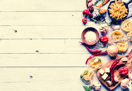 Top view of all the necessary food component to make a classic italian pasta with tomato sauce with basil and olive oil!の写真素材