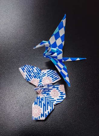 Folding paper crane and butterfly, origami traditional japanese craftsmanshipの写真素材