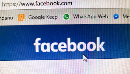 Facebook banner with cursor on the button of the interface. URL of the social network. Google Keep...