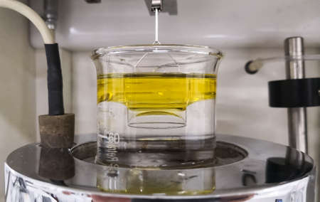 Force tensiometer to measure surface or interfacial tension between two immiscible liquids such as...
