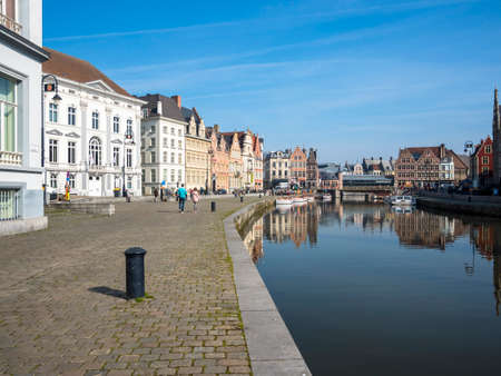 Promenade at the Korenlei, with old guild houses on the river Leie, Ghent, Flanders, Belgium, Europeのeditorial素材
