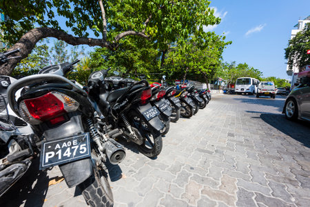 Mopeds stand at the roadside of Male the capital of the Maldives, Feb 2013の写真素材