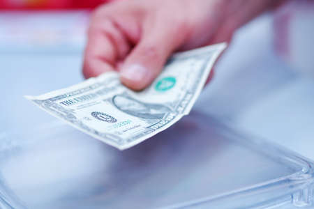 Human hand holding money in paying.の写真素材