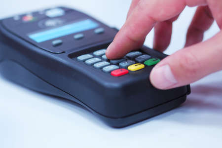 Human hand holding card in paying.の写真素材