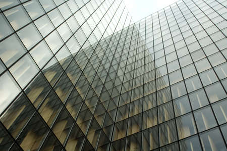 looking up at reflections on a skyscraper windowのeditorial素材