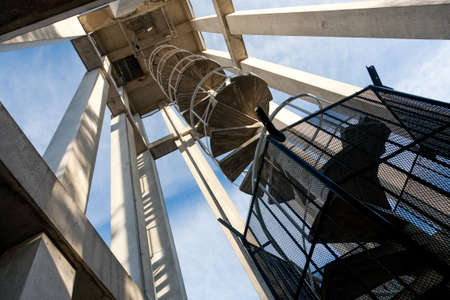 detail of a modern clock tower and spiral staircase, Victoria, BC, Canadaのeditorial素材