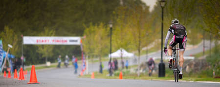 cyclist on the final stretch in a race, Sooke Road Race 2010, Victoria, Vancouver Island, British...