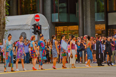 Fashion models parading on the busy Orchard road in Singapore.のeditorial素材