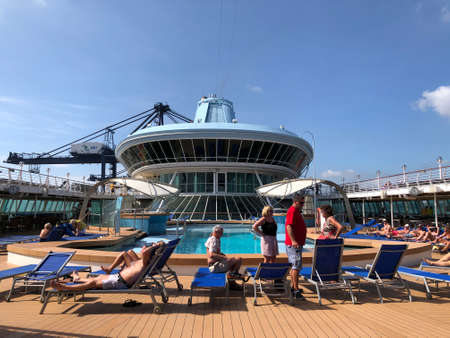 Passengers relaxing on the sun deck of the cruise ship at Phu My Port at Vietnam in mid Dec 2019.のeditorial素材