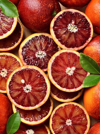 Blood red oranges Sicilian oranges sliced on woodの写真素材