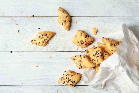 Cheese crackers with paper package on wooden backgroundの写真素材
