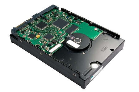 Closeup shot of an isolated hard drive, upside down, on a white background.