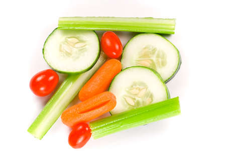 Isolated shot of wet vegetable sticks on a white background.の写真素材
