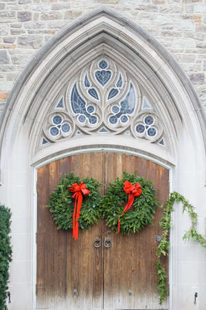 Doors to church entrance decorated for Christmas.の写真素材
