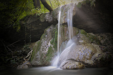 Beautiful waterfall in the forest. Soft focus, long exposure.