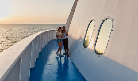 woman on deck of ferry boatの写真素材