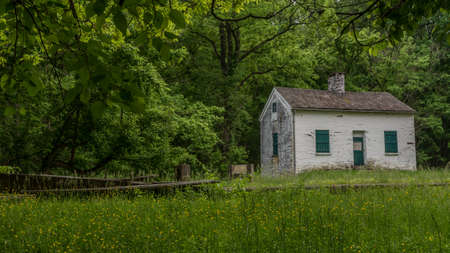 Lock keepers white house with green shutters and door on the Chesapeake and Ohio Canal