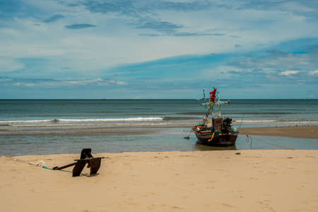 Traditional Thai ishing boats at the beach in Pak Nam Pram, Thailandの写真素材