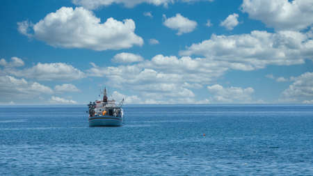 Greek fishing boat at anchor off the coast of  the islands of Lesvos in Greece