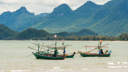 Traditional Thai ishing boats at the beach in Pak Nam Pram, Thailand