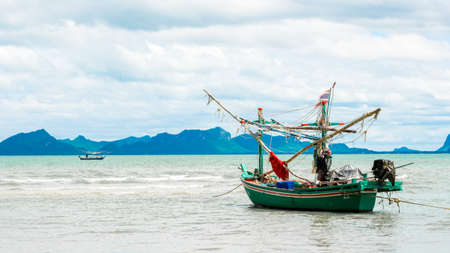 Traditional Thai ishing boats at the beach in Pak Nam Pram, Thailand