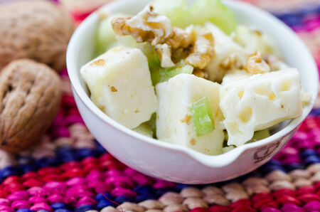a fresh salad  with celery, nuts and cheeseの写真素材