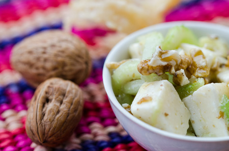 a fresh salad  with celery, nuts and cheeseの写真素材