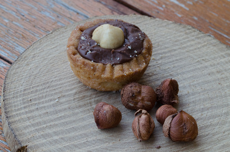 Hazelnuts with some chocolate biscuitsの写真素材
