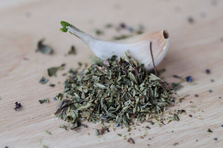 Garlic on the table with oreganoの写真素材