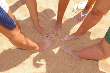 Five feet in the red sand of Menorca, Spainの写真素材