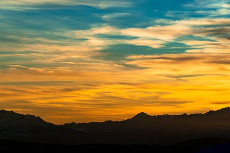 Sunset sky with beautiful orange and blue colorsの写真素材