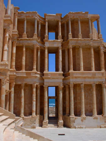 The spectacular building of the roman amphitheatre in Sabratha, an ancient roman city, in Libya, North Africa, in front of Mediterranean Sea の写真素材